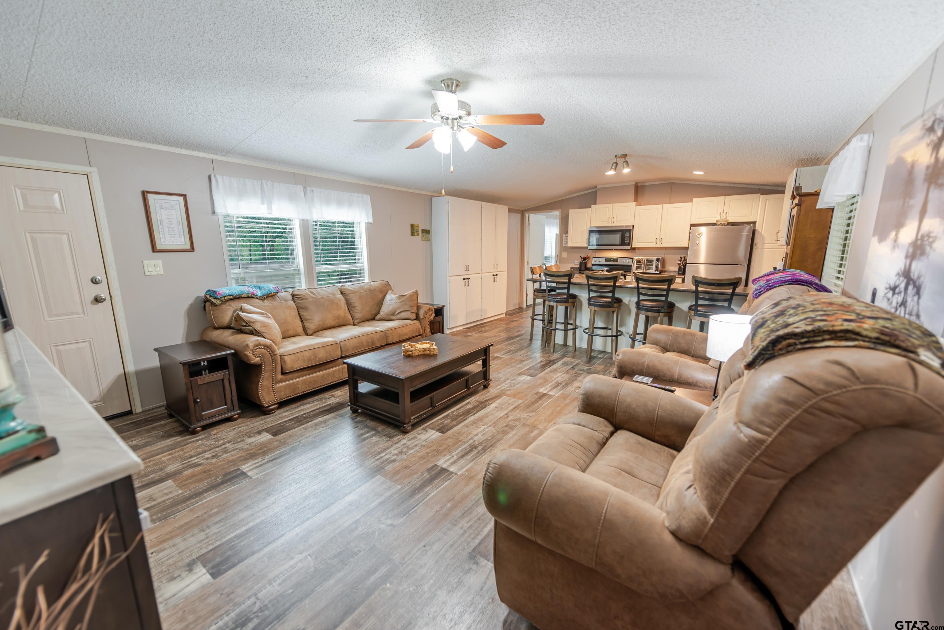 108 Sandy Brown Road Scroggins, TX 75480 - Photo 13 of 17 a living room with furniture and a large window