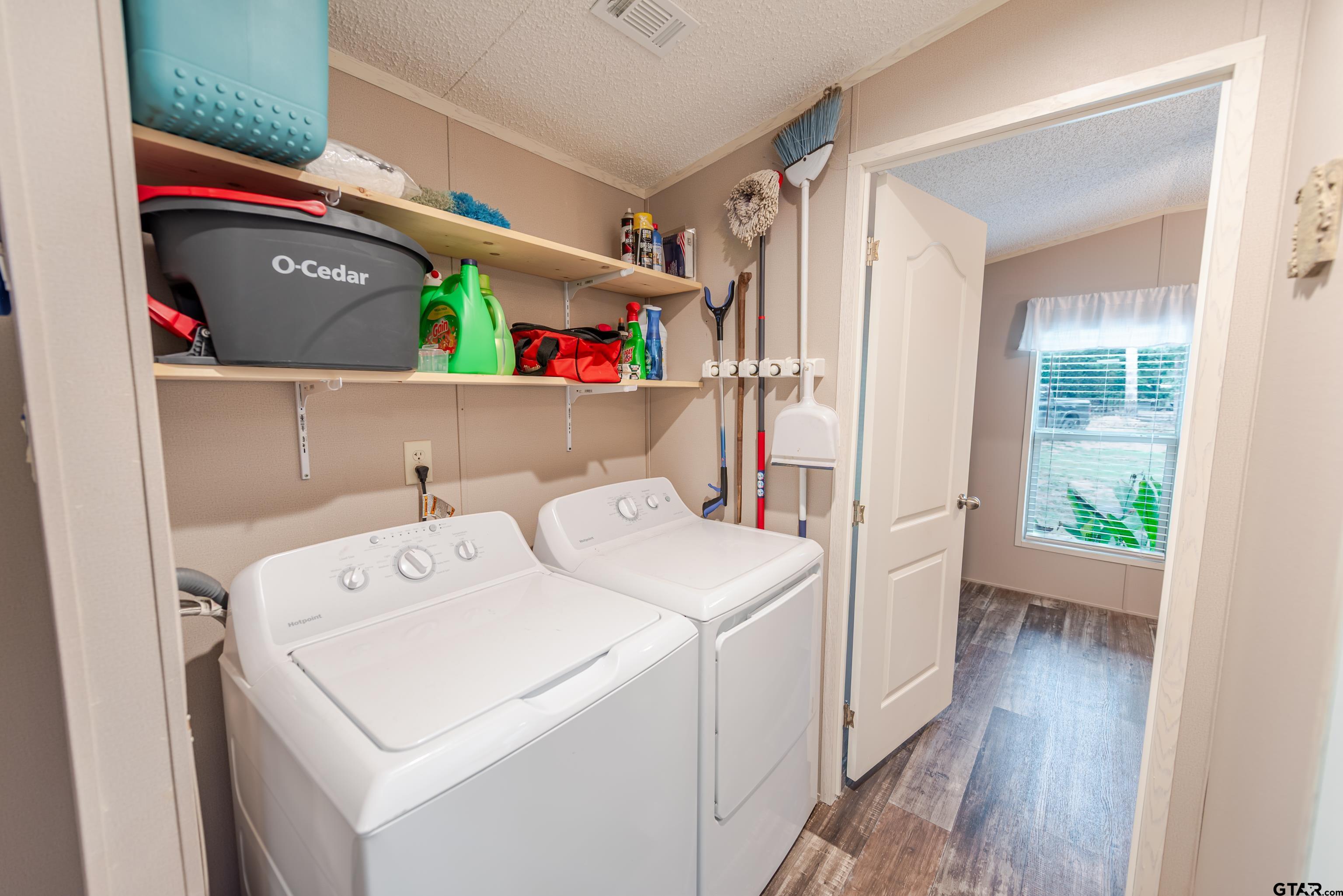 108 Sandy Brown Road Scroggins, TX 75480 - Photo 17 of 17 a utility room with dryer and washer