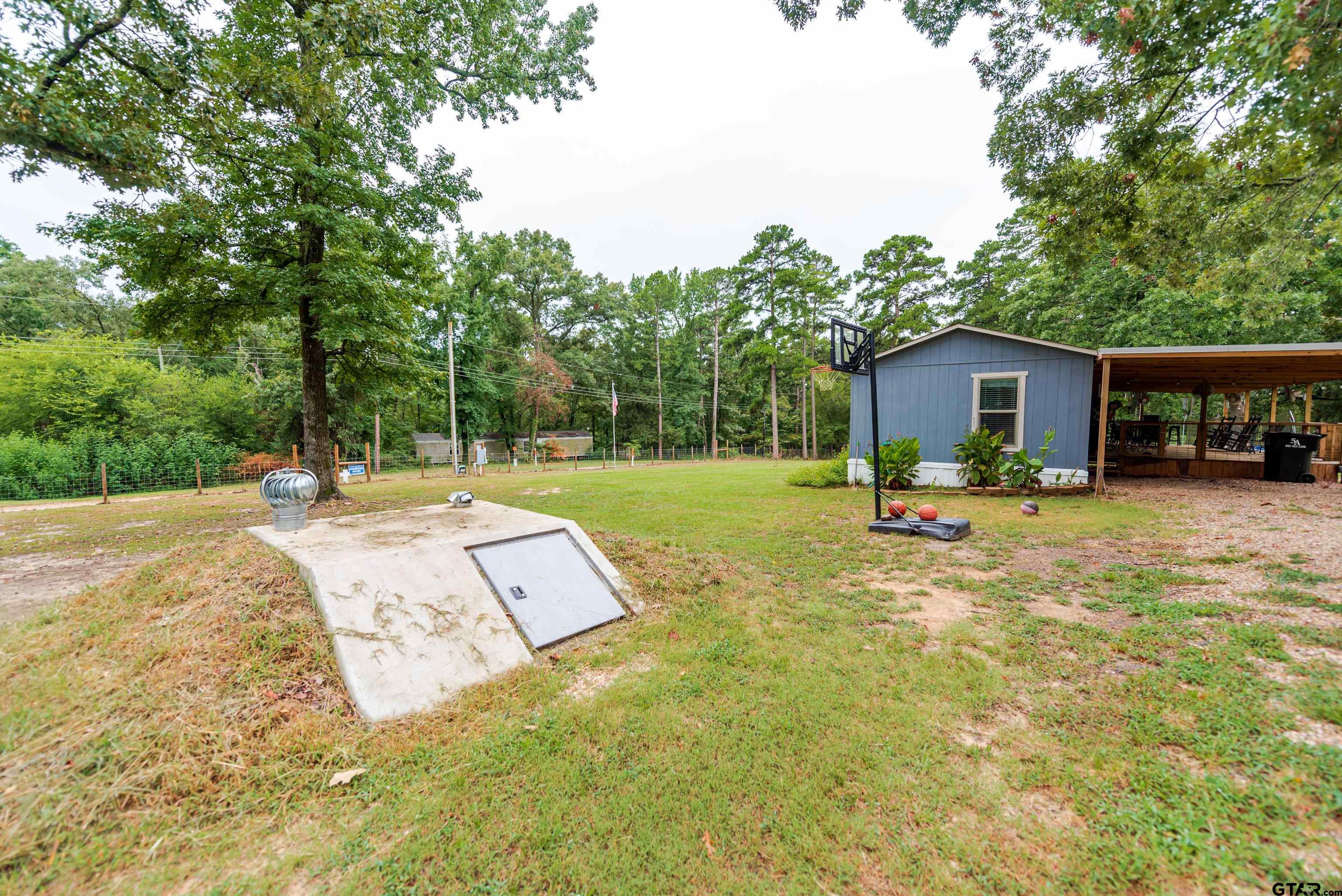 108 Sandy Brown Road Scroggins, TX 75480 - Photo 4 of 17 a view of a house with a yard and sitting area