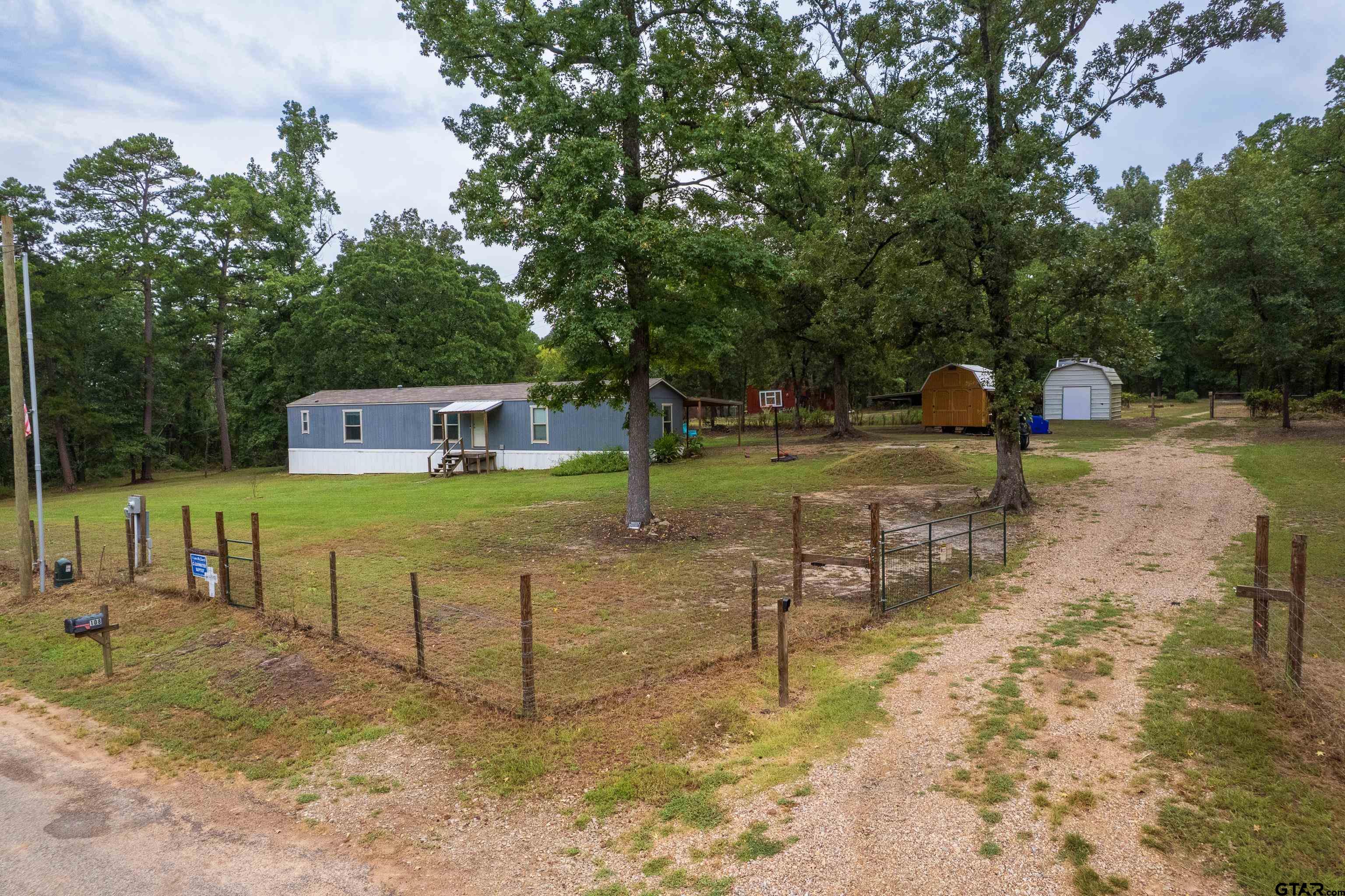 108 Sandy Brown Road Scroggins, TX 75480 - Photo 6 of 17 a view of a park with swings on the wall