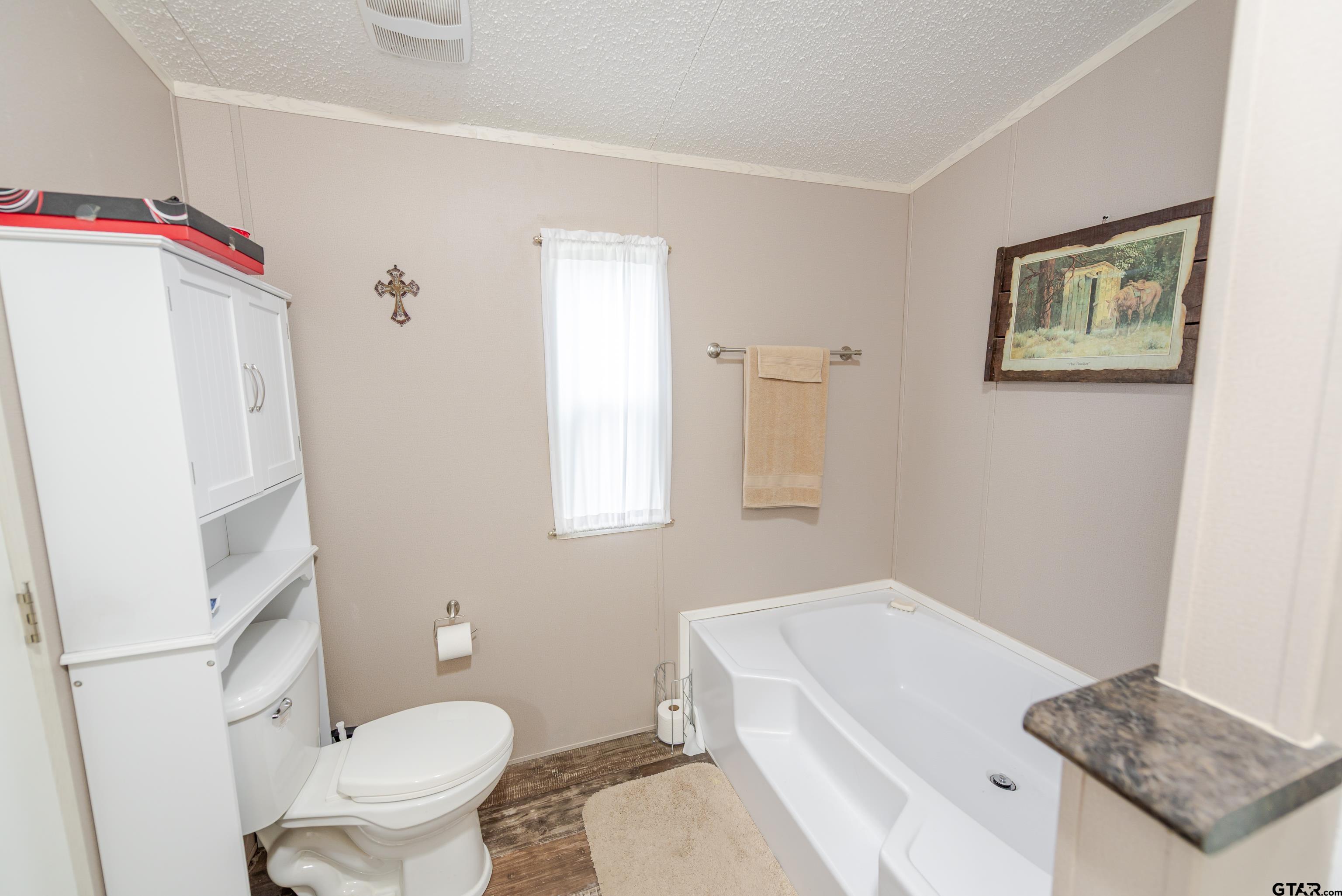 108 Sandy Brown Road Scroggins, TX 75480 - Photo 8 of 17 a bathroom with a sink a toilet and a shower
