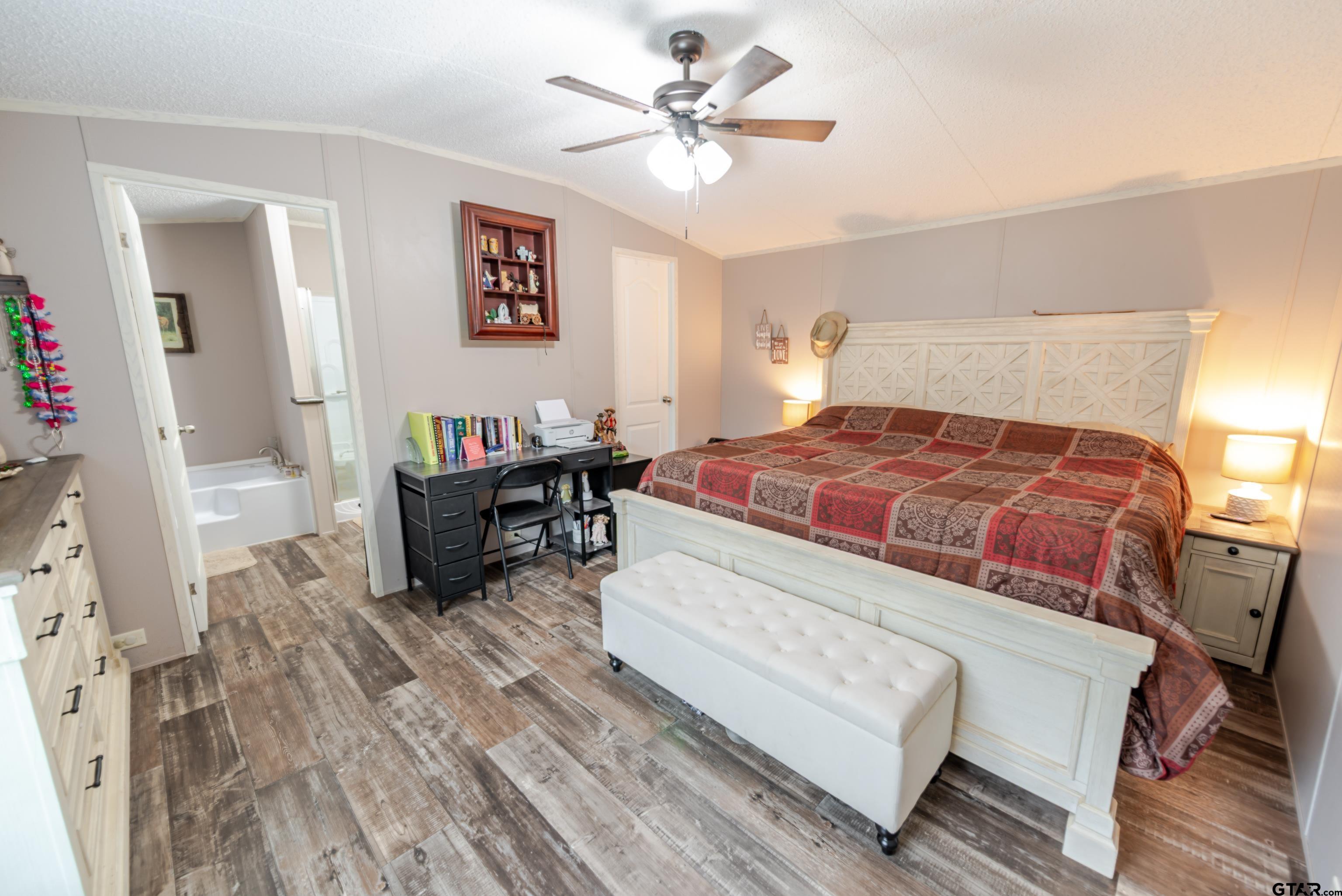 108 Sandy Brown Road Scroggins, TX 75480 - Photo 10 of 17 a bedroom with a bed furniture and a table