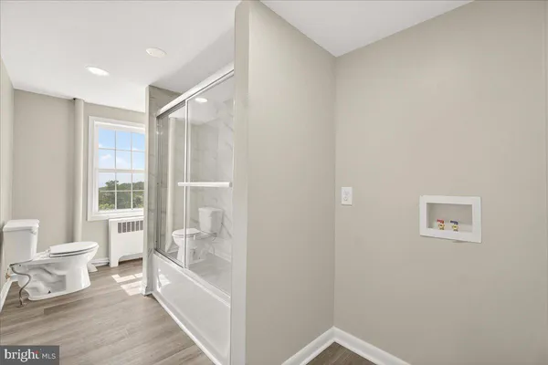 a bathroom with a bathtub and a shower