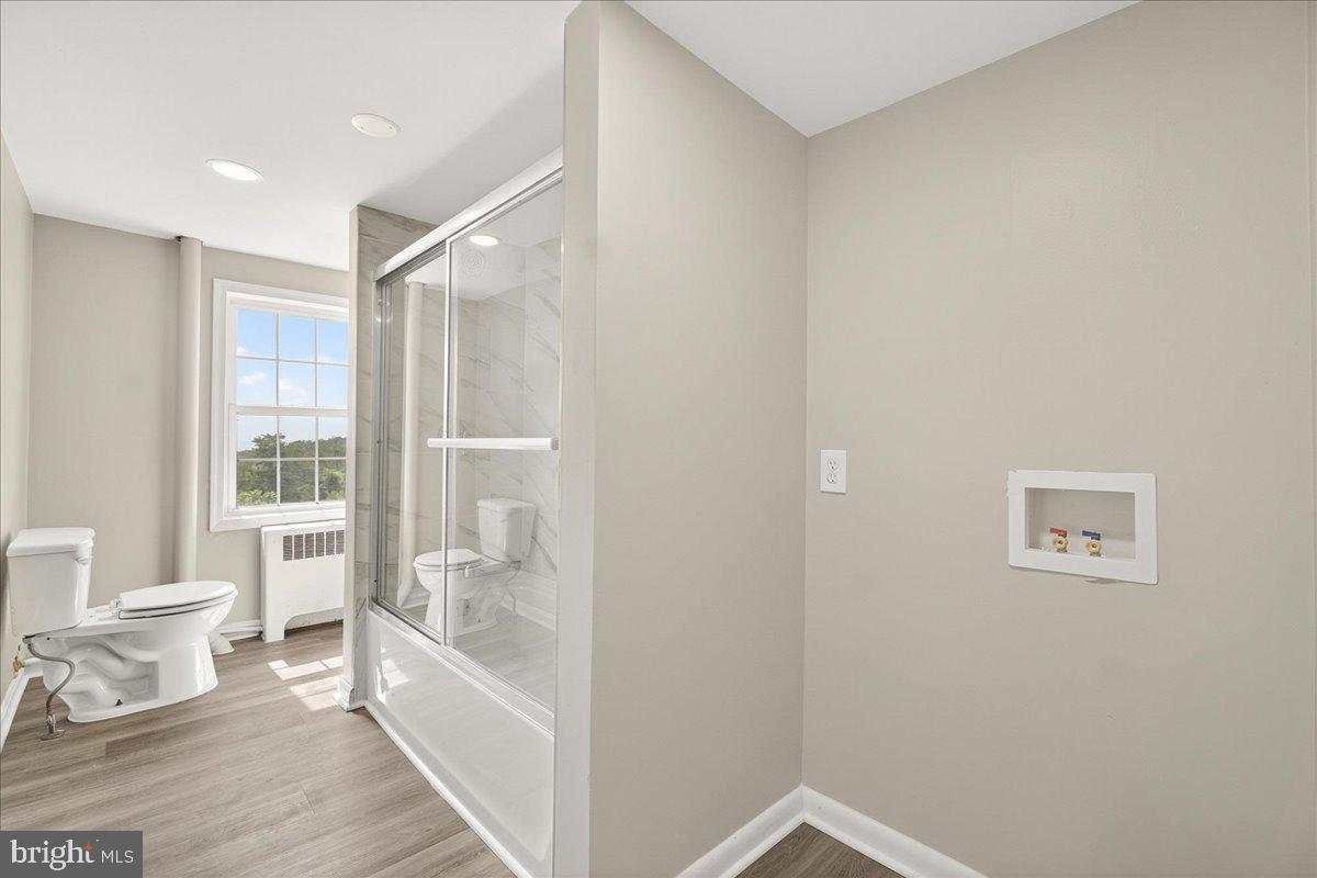 6215 South Clifton Road Braddock Heights, MD 21703 - Photo 21 of 46 a bathroom with a bathtub and a shower