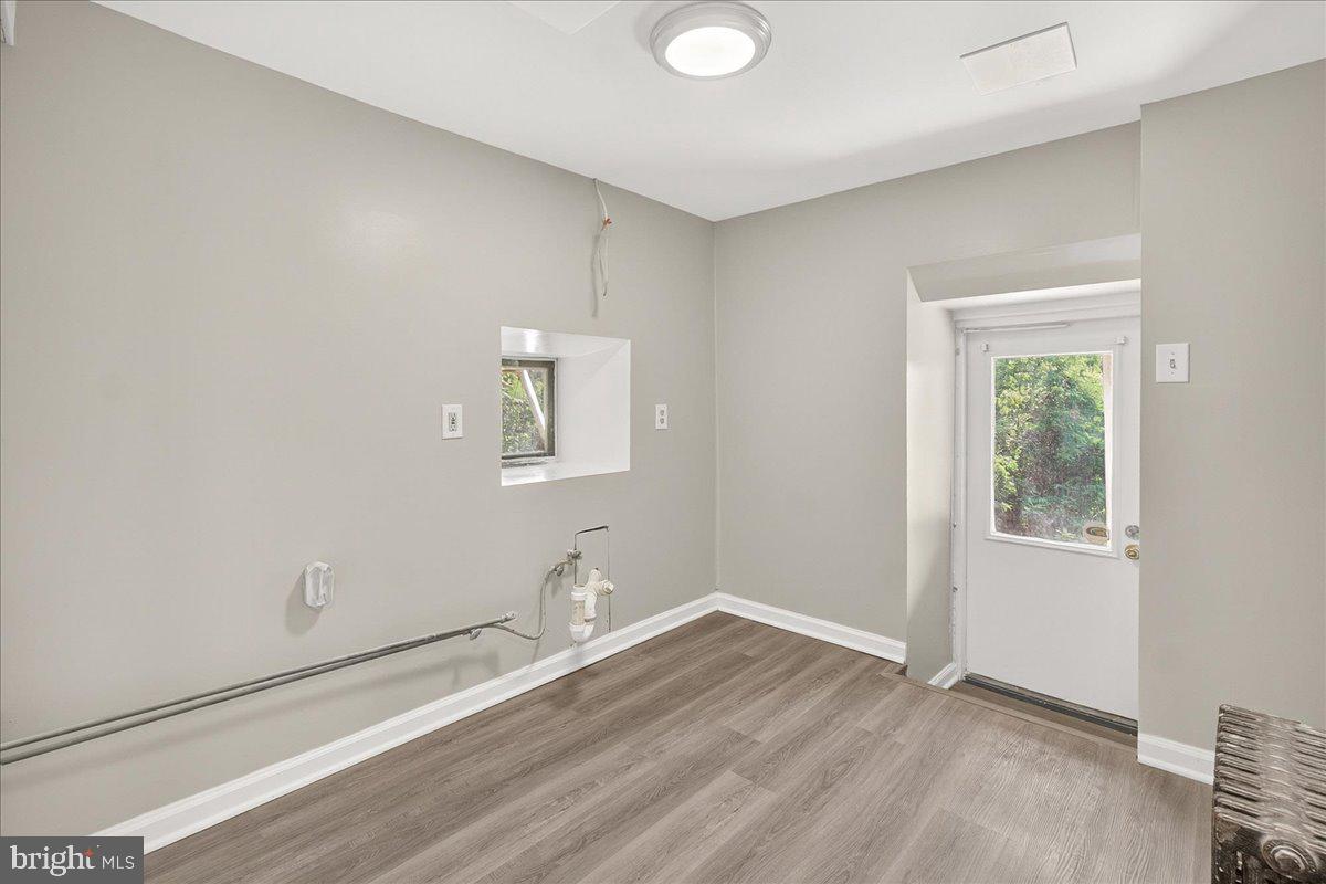 6215 South Clifton Road Braddock Heights, MD 21703 - Photo 28 of 46 an empty room with wooden floor and windows