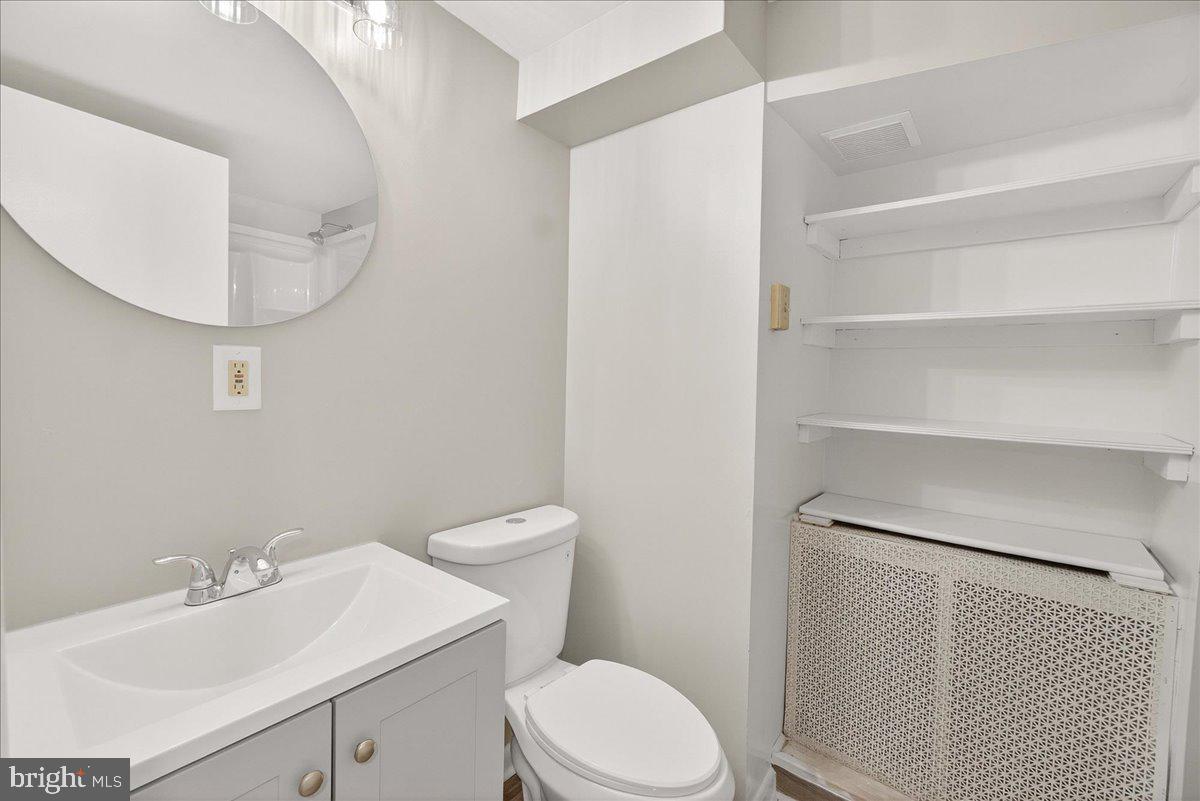6215 South Clifton Road Braddock Heights, MD 21703 - Photo 29 of 46 a white toilet sitting next to a bathroom sink