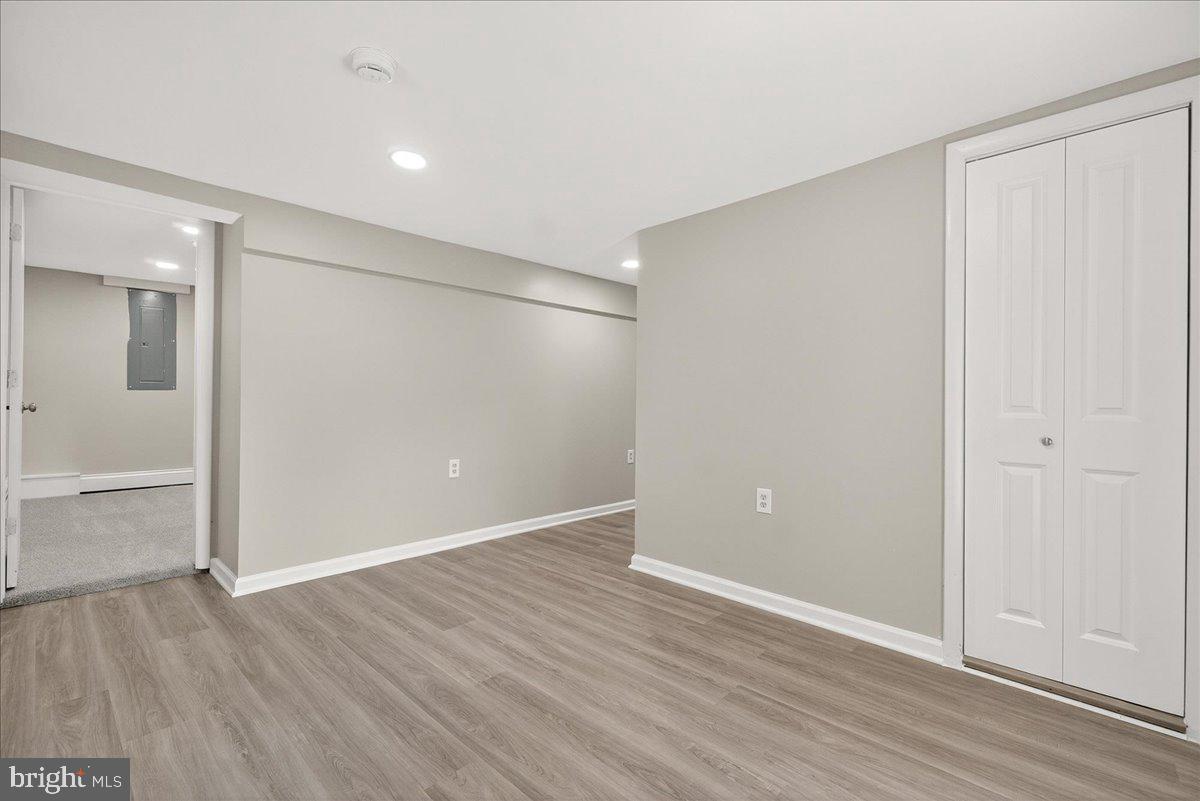 6215 South Clifton Road Braddock Heights, MD 21703 - Photo 32 of 46 a view of an empty room with wooden floor