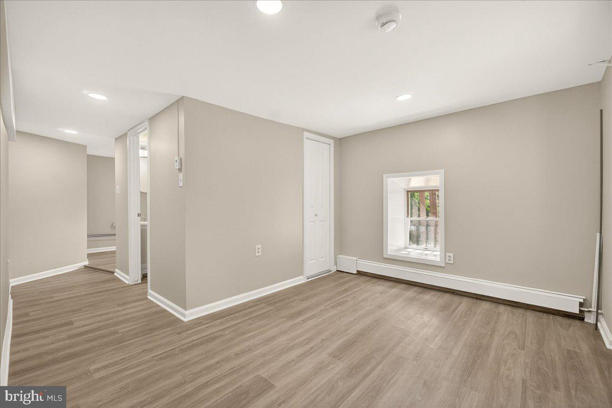 6215 South Clifton Road Braddock Heights, MD 21703 - Photo 34 of 46 an empty room with wooden floor and windows