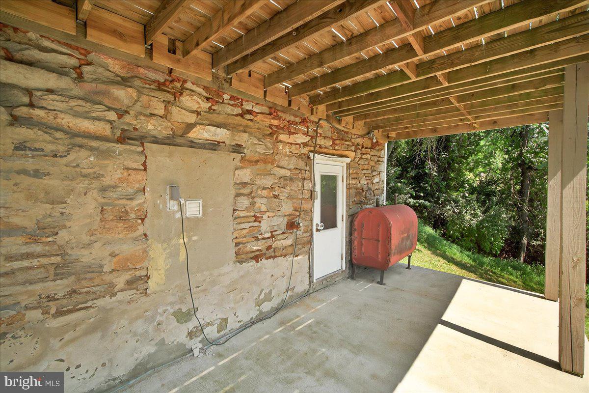 6215 South Clifton Road Braddock Heights, MD 21703 - Photo 39 of 46 a view of a backyard with table and chairs and a barbeque