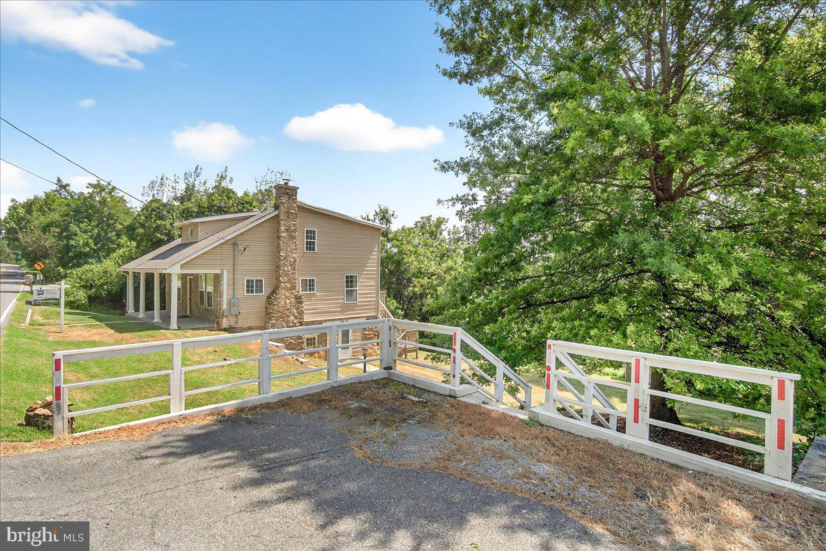 6215 South Clifton Road Braddock Heights, MD 21703 - Photo 45 of 46 a view of a house with a yard