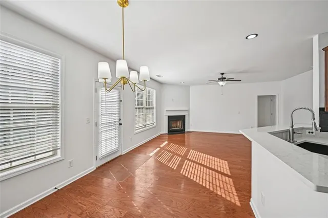 a kitchen with stainless steel appliances granite countertop a refrigerator and cabinets