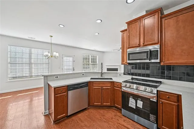 a bathroom with a sink a toilet and a large mirror