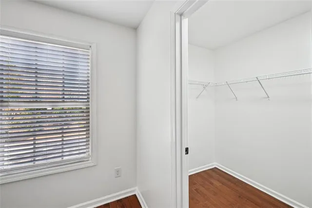 a view of an entryway with wooden floor