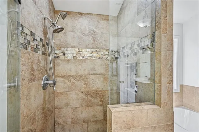 a view of a room with wooden floor and fan