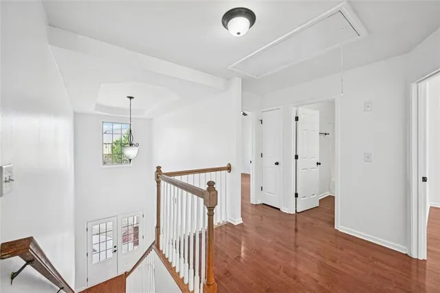 a view of a house with backyard and trees