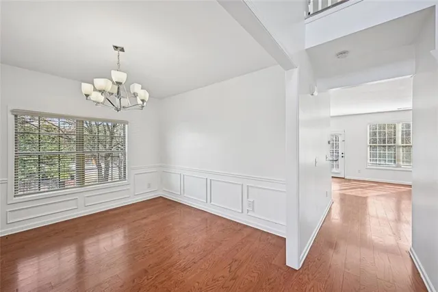 a view of an empty room with a fireplace and a window