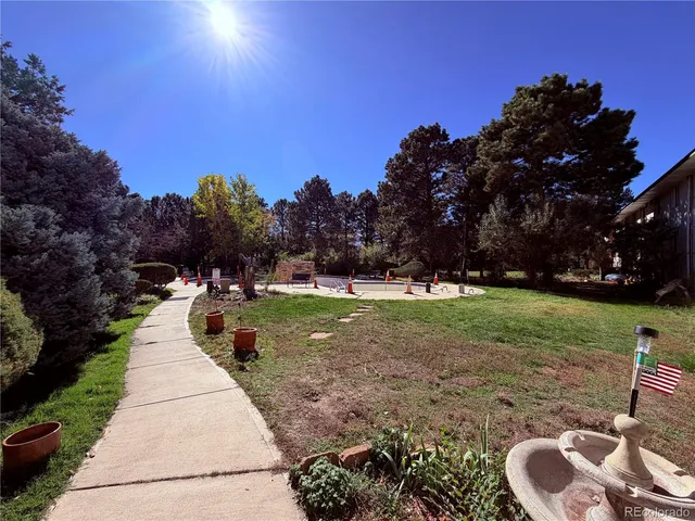 a swimming pool with wooden fence