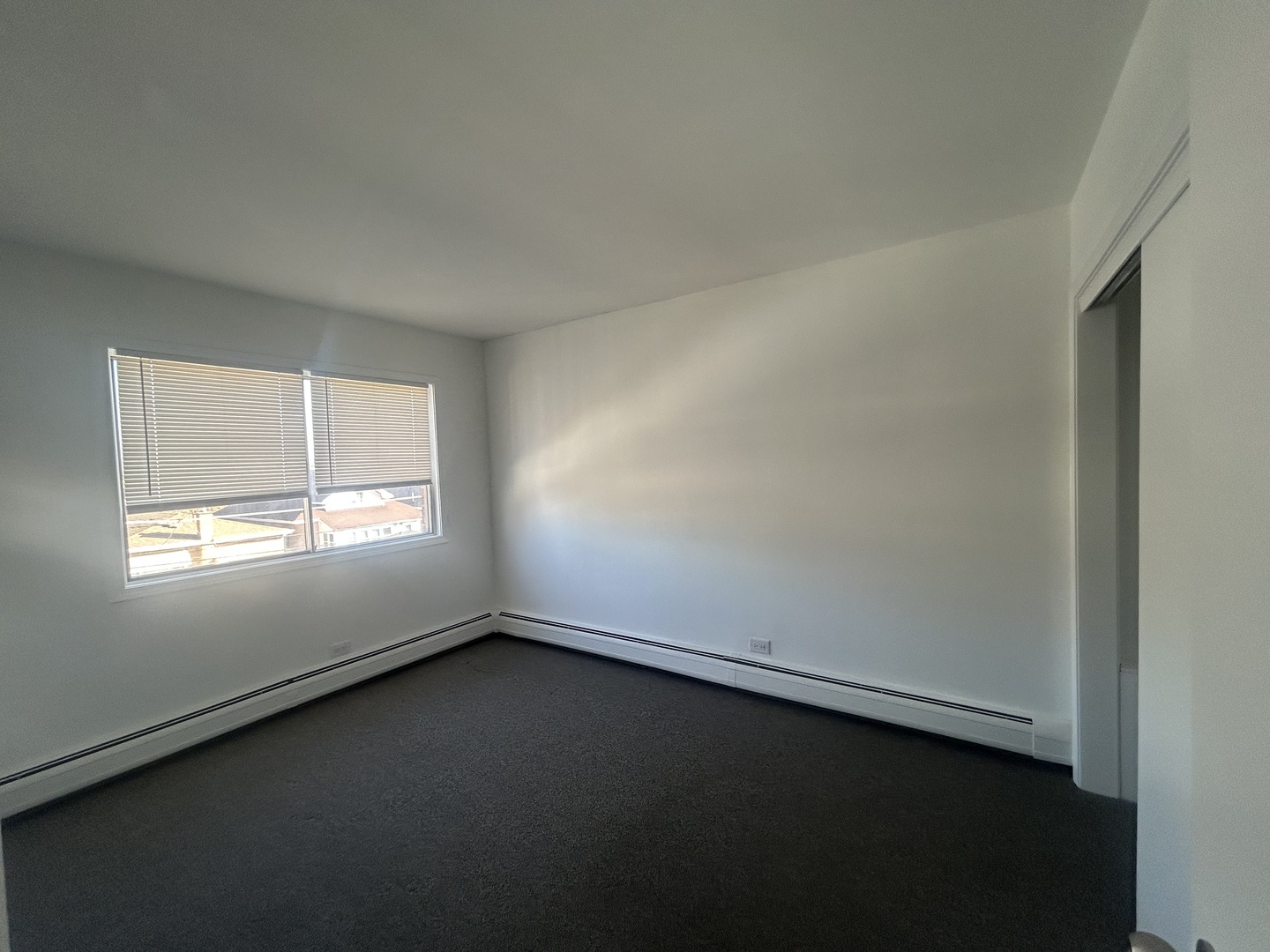 2825 Ridgeland Avenue, Unit 10 Berwyn, IL 60402 - Photo 7 of 8 an empty room with a window