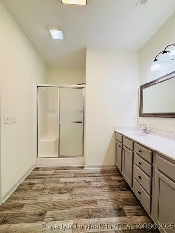 a view of a bathroom with sink and mirror