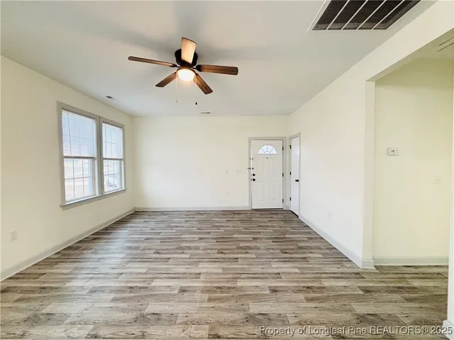 a view of a livingroom with wooden floor