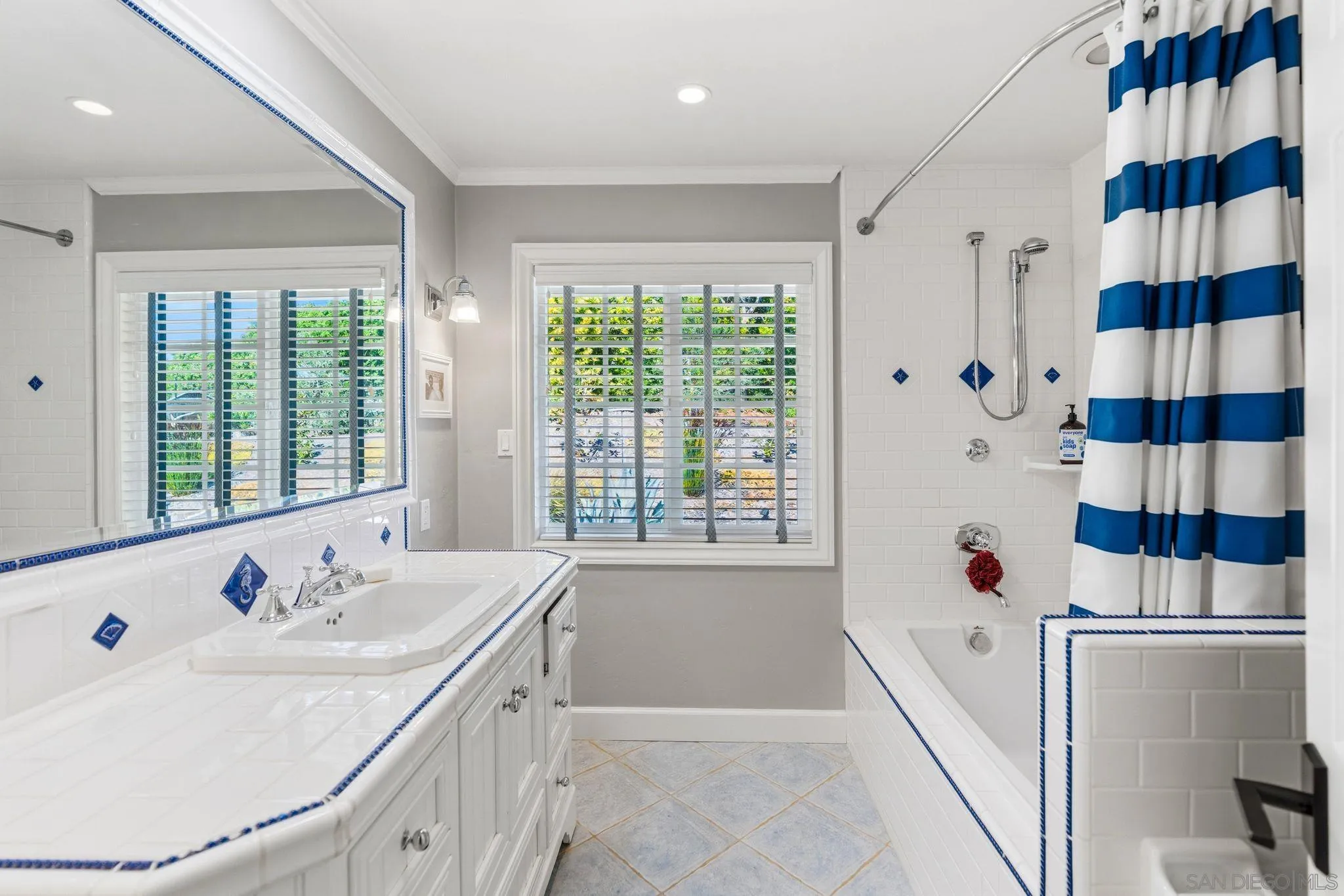 8 Country Glen Road Fallbrook, CA 92028 - Photo 17 of 30 a bathroom with a sink and a large mirror