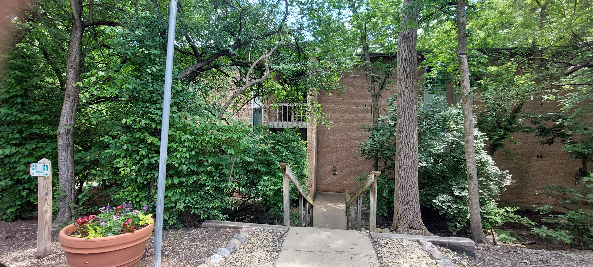 6010 Forest View Road, Unit 1A Lisle, IL 60532 - Photo 1 of 39 a house view with a outdoor space
