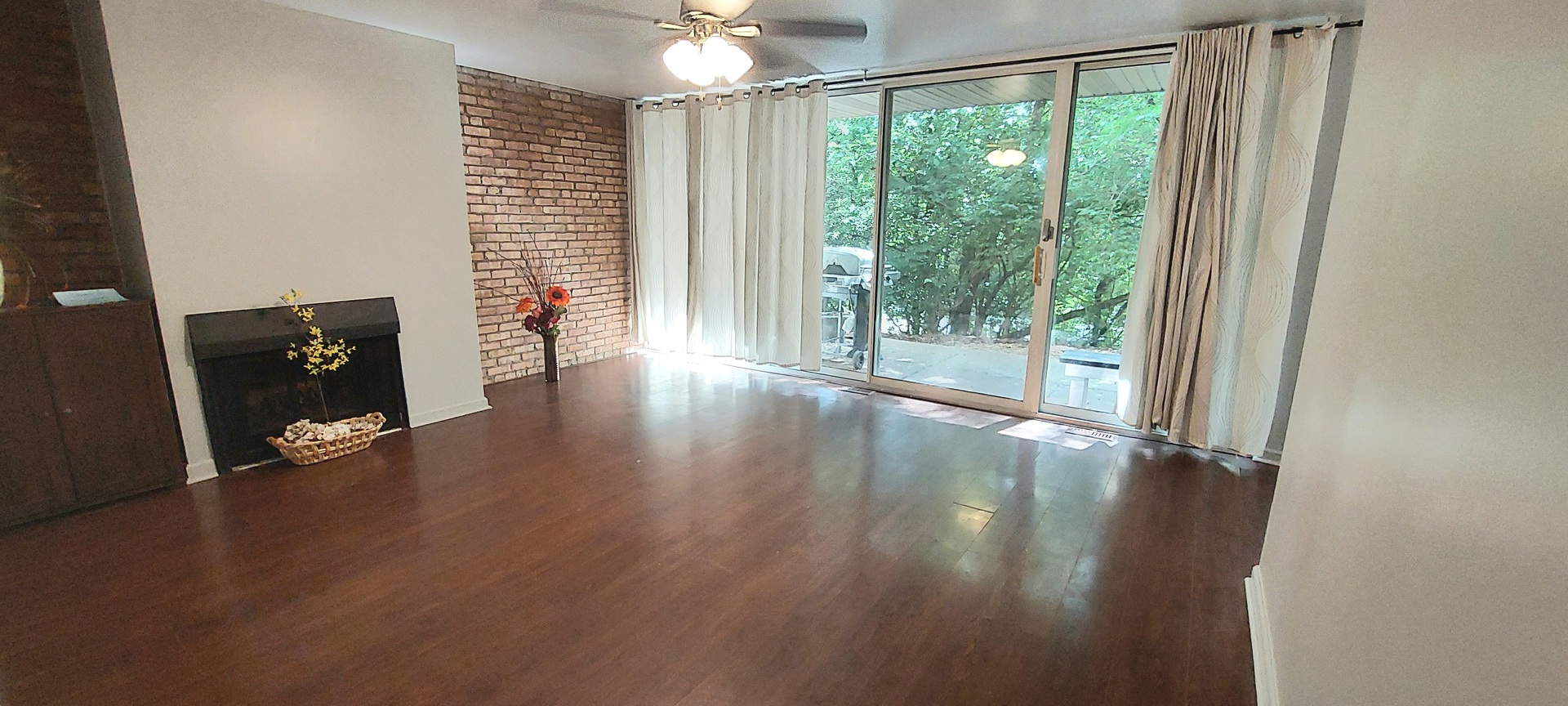6010 Forest View Road, Unit 1A Lisle, IL 60532 - Photo 10 of 39 a view of an empty room with wooden floor and a window