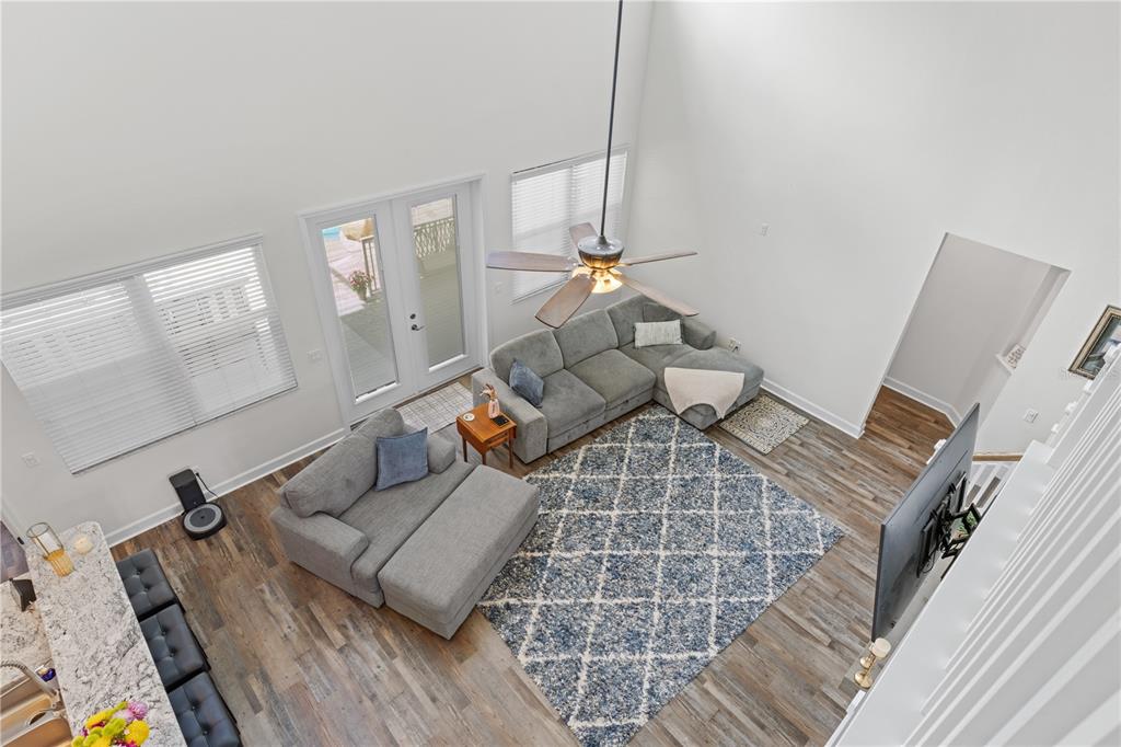 16948 Deer Island Road Tavares, FL 32778 - Photo 29 of 67 a living room with furniture and a rug