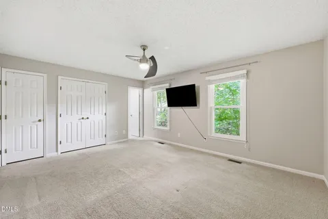 an empty room with a empty space and bathroom