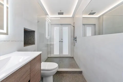 a view of living room with patio furniture and potted plants