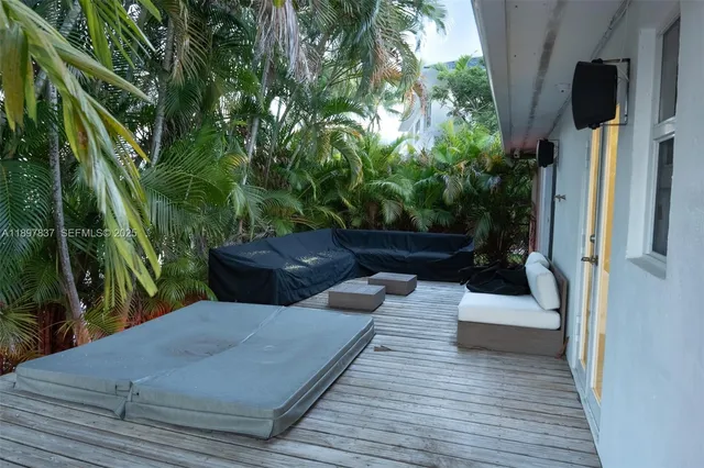 a front view of a house with a garden and yard