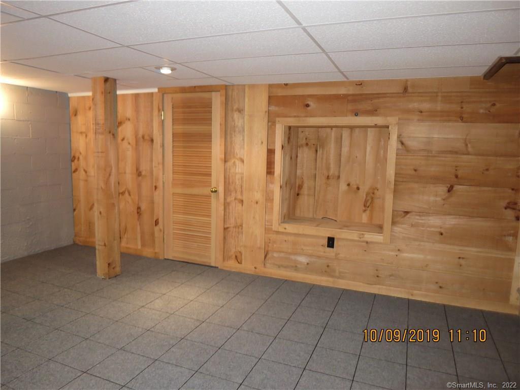 22 Garnet Park Road Madison, CT 06443 - Photo 16 of 18 This family room wall has a built in area waiting for your television.