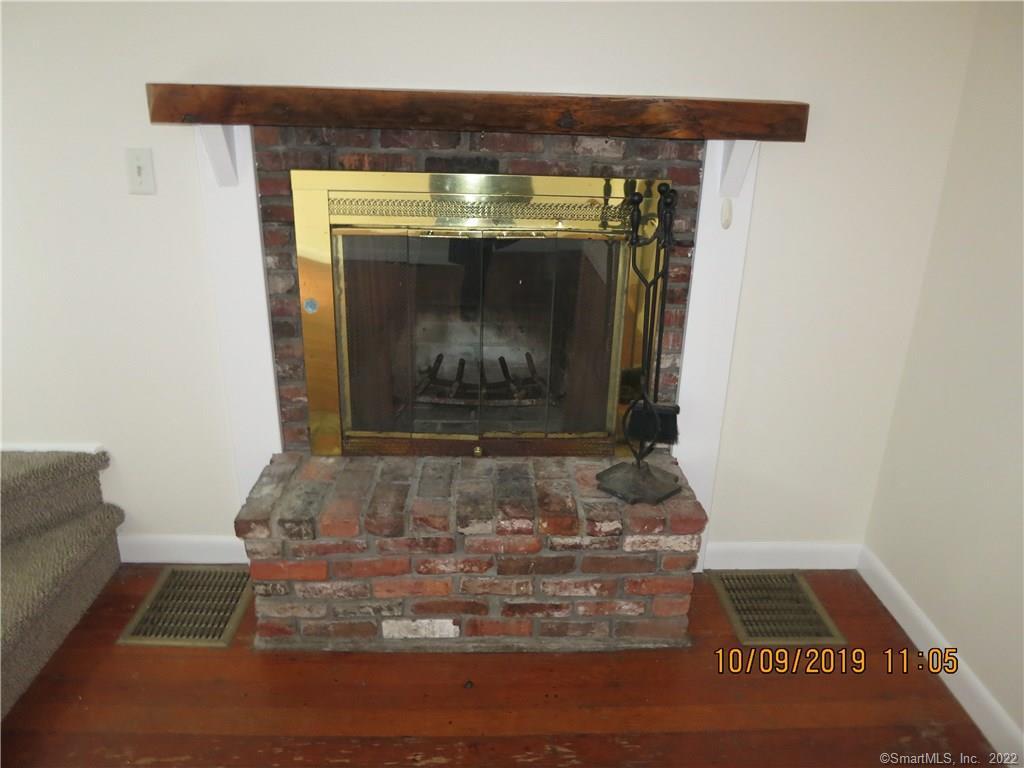 22 Garnet Park Road Madison, CT 06443 - Photo 3 of 18 Wood burning fireplace.