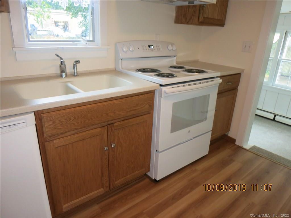 22 Garnet Park Road Madison, CT 06443 - Photo 6 of 18 A completely remodeled kitchen with a new stove, cabinetry and sink.