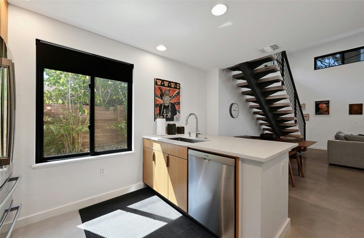 407 South Park Drive, Unit 2 Austin, TX 78704 - Photo 13 of 25 a kitchen that has a sink and a stove in it