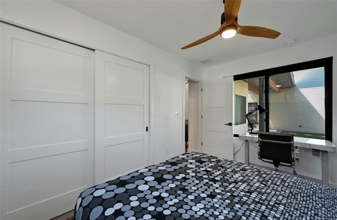 407 South Park Drive, Unit 2 Austin, TX 78704 - Photo 15 of 25 a bedroom with a bed and a dresser