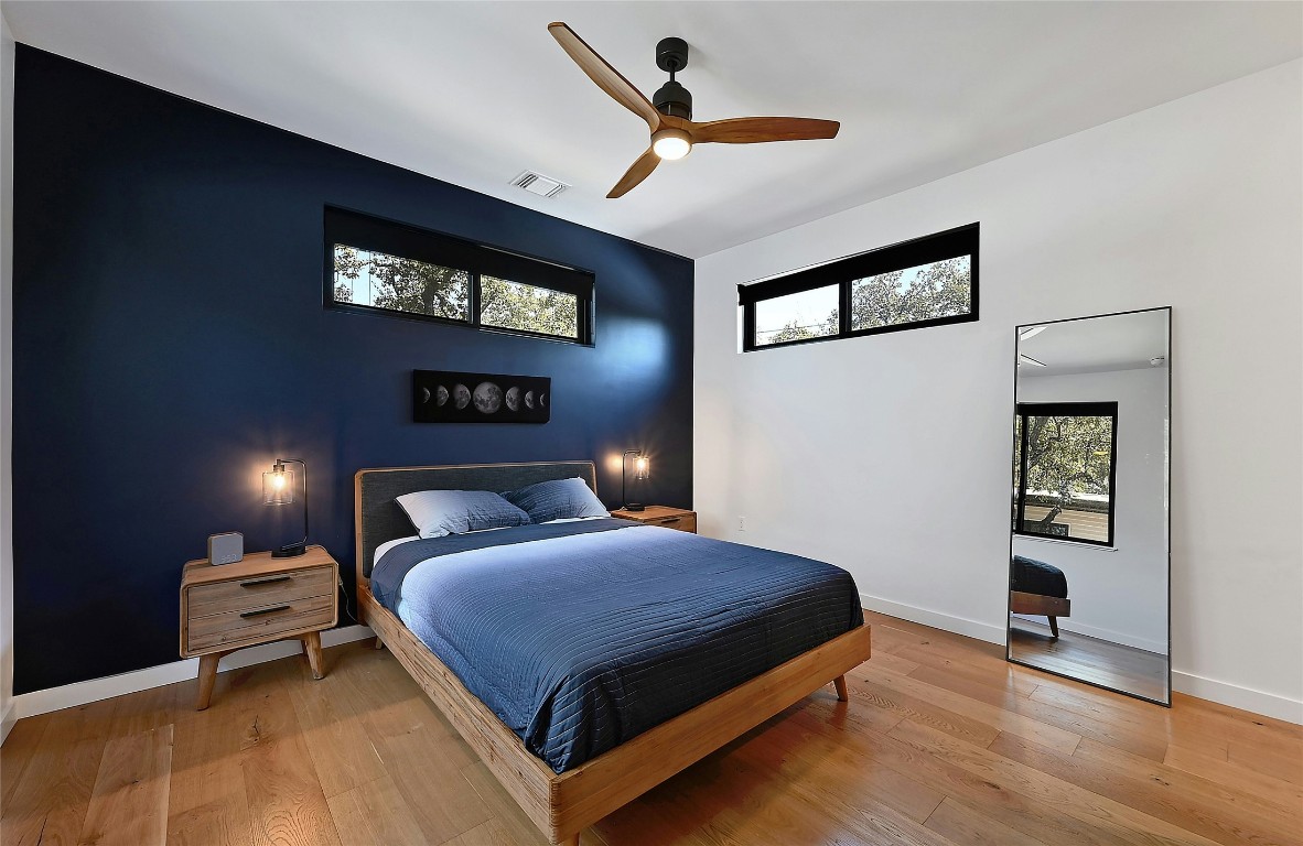 407 South Park Drive, Unit 2 Austin, TX 78704 - Photo 19 of 25 a bedroom with a bed and dresser