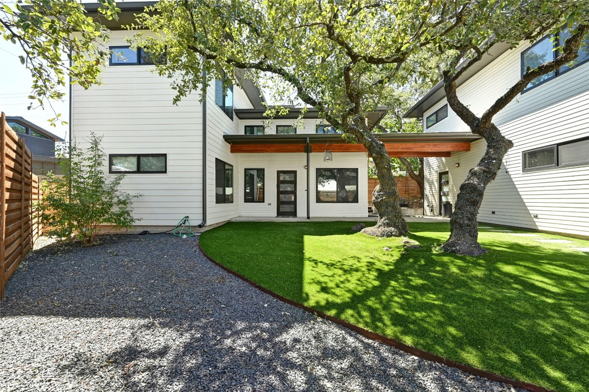 407 South Park Drive, Unit 2 Austin, TX 78704 - Photo 2 of 25 a front view of a house with garden