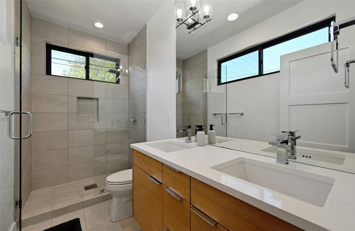 407 South Park Drive, Unit 2 Austin, TX 78704 - Photo 21 of 25 a bathroom with a sink a toilet and shower