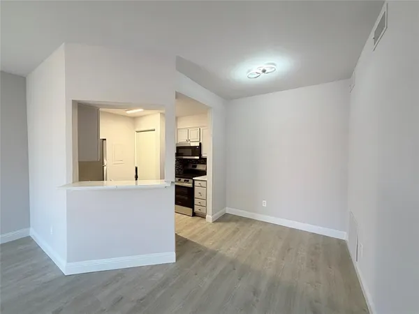 a view of kitchen with wooden floor