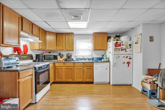 a kitchen with stainless steel appliances granite countertop a sink and cabinets