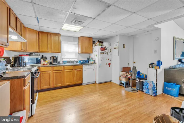 a kitchen with a sink cabinets and window