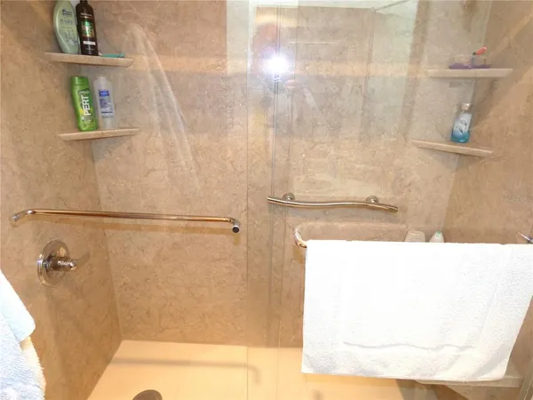 a bathroom with a bathtub and shower