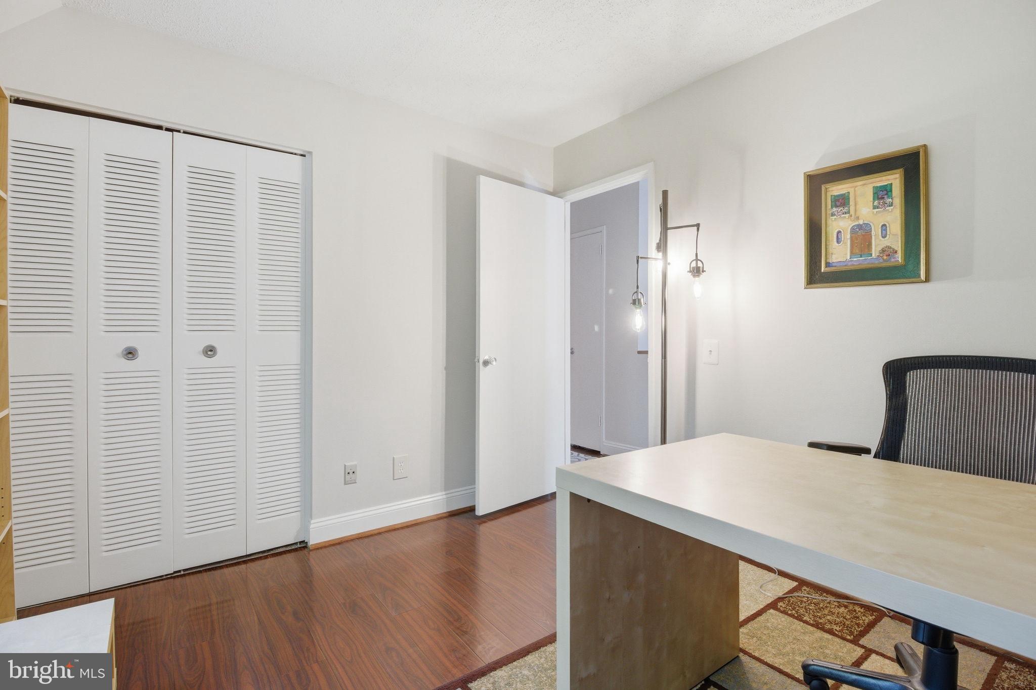 1509 Farsta Court Reston, VA 20190 - Photo 17 of 40 a bedroom with a bed and a table