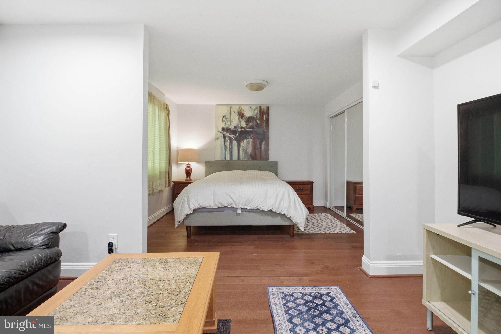 1509 Farsta Court Reston, VA 20190 - Photo 22 of 40 a bedroom with a bed and a flat screen tv