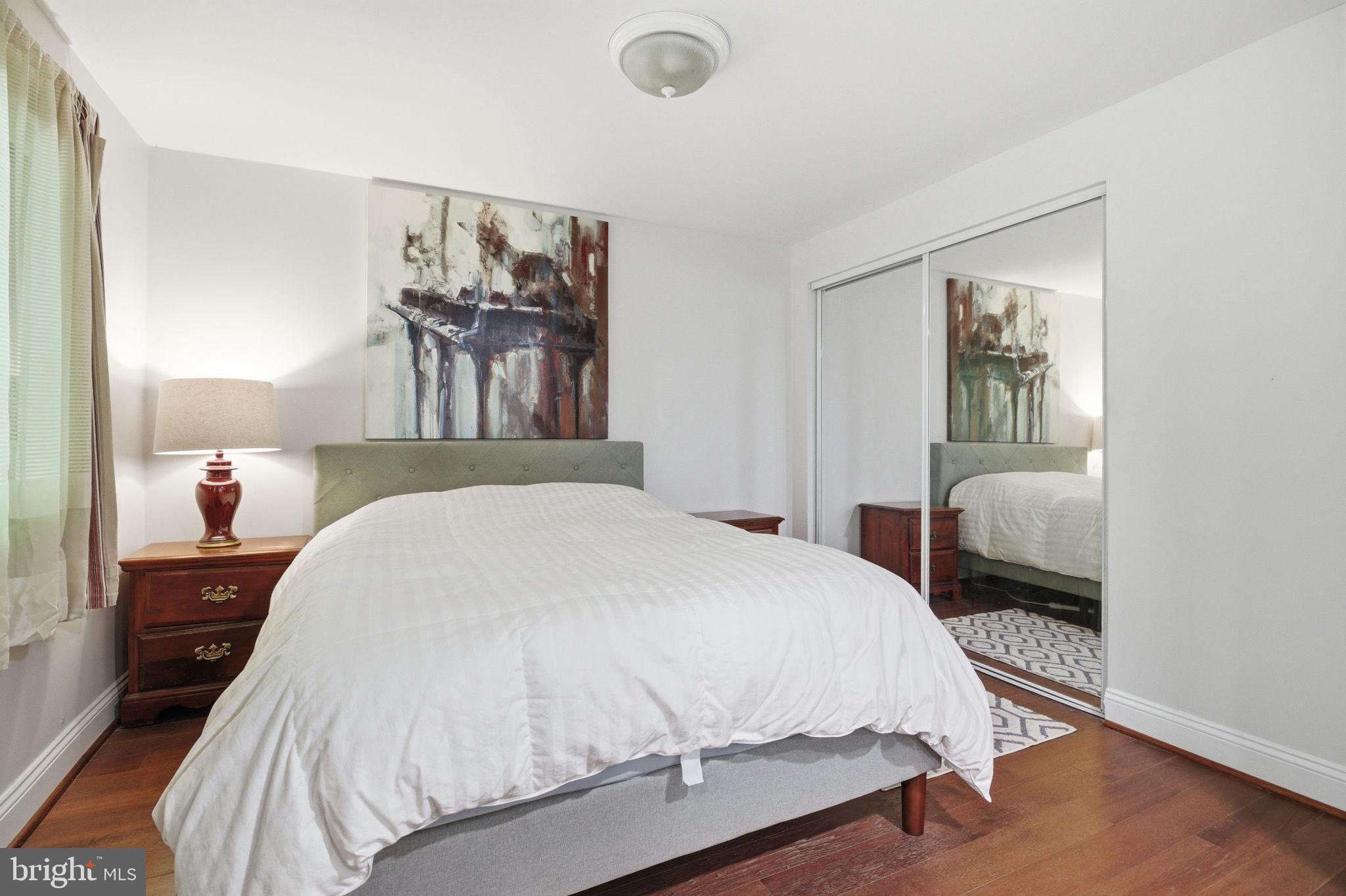 1509 Farsta Court Reston, VA 20190 - Photo 23 of 40 a bedroom with a bed and a painting on the wall
