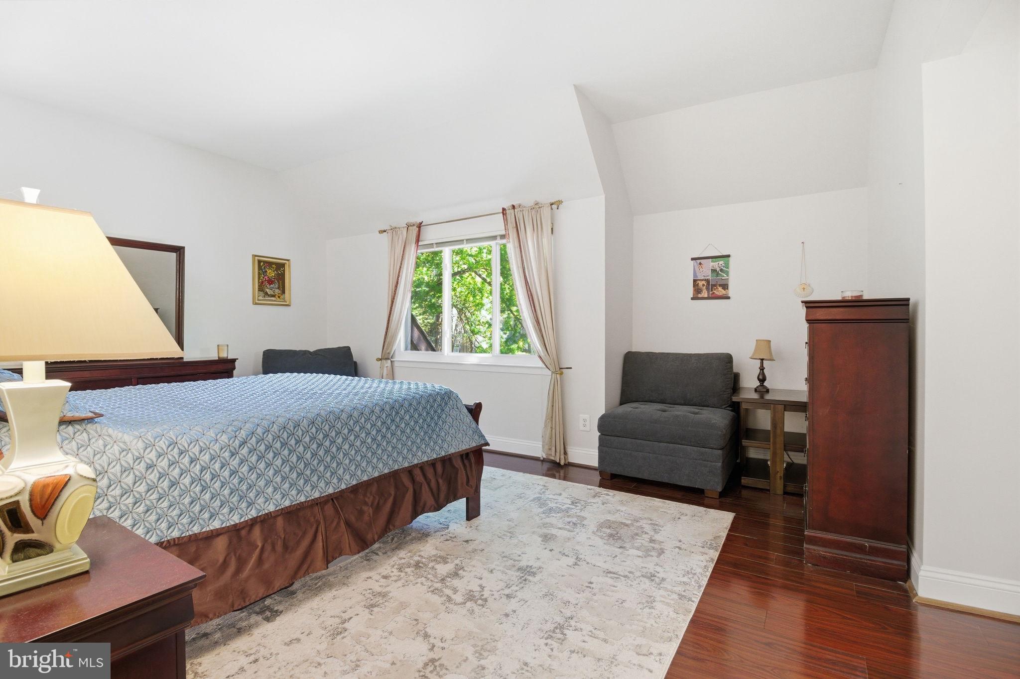 1509 Farsta Court Reston, VA 20190 - Photo 30 of 40 a bedroom with a bed and wooden floor