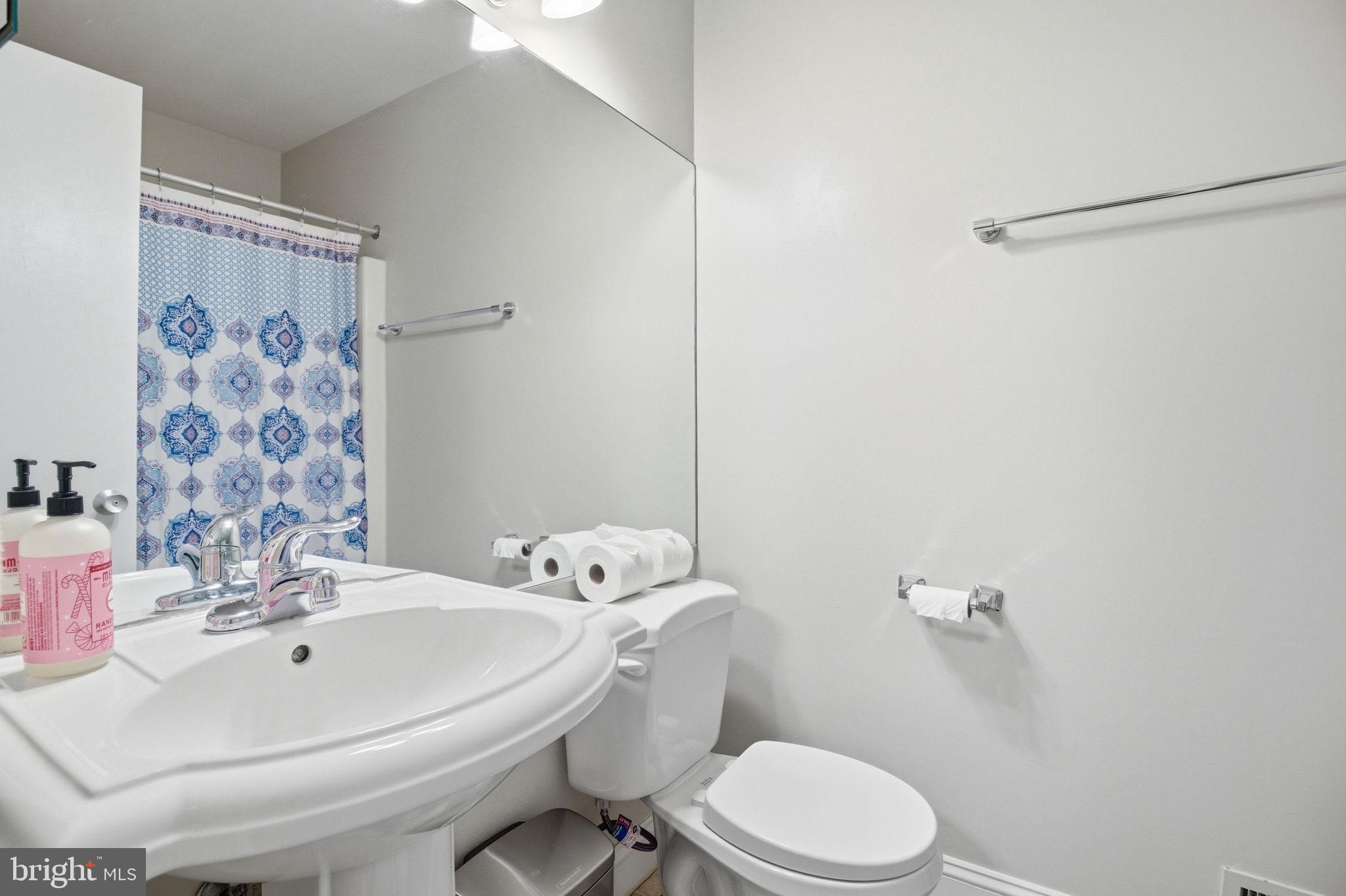 1509 Farsta Court Reston, VA 20190 - Photo 35 of 40 a white toilet sitting next to a bathroom sink
