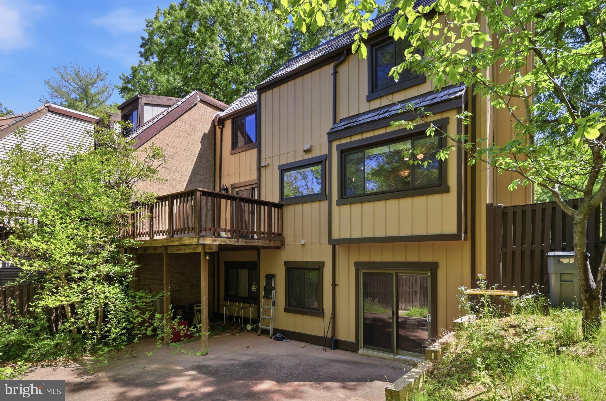 1509 Farsta Court Reston, VA 20190 - Photo 40 of 40 a view of a house with a plants and a tree