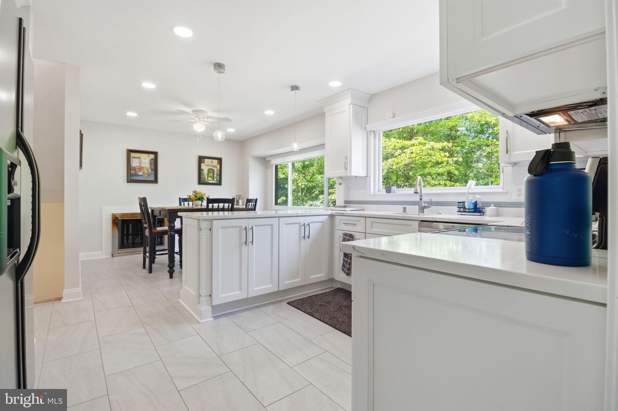 1509 Farsta Court Reston, VA 20190 - Photo 7 of 40 a kitchen with stainless steel appliances granite countertop a refrigerator and a sink